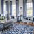 Blue & white living room with a blue & white rug with a modern pattern. Custom sized by Bountiful Flooring.