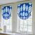 Custom window treatments by Bountiful Home - roman shades in a blue and white ginger jar pattern