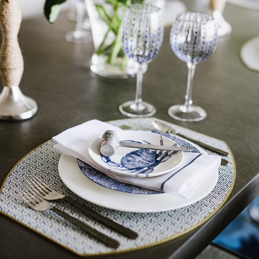 Dinnerware and glassware at Bountiful Home - blue and white place setting with crab plate and wine goblets